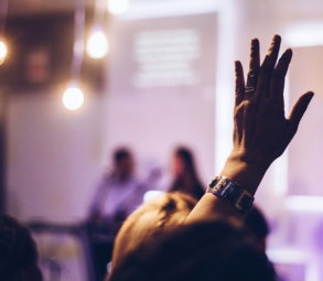 person raising hand